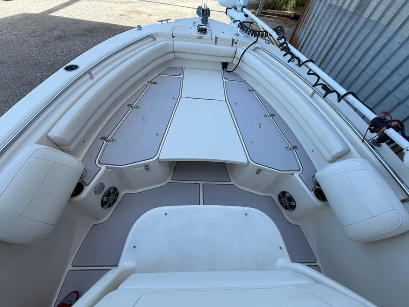 Slide: The Image of 2020 Grady-White Fisherman 257 boat interior with cushioned seating and storage compartments. - 19