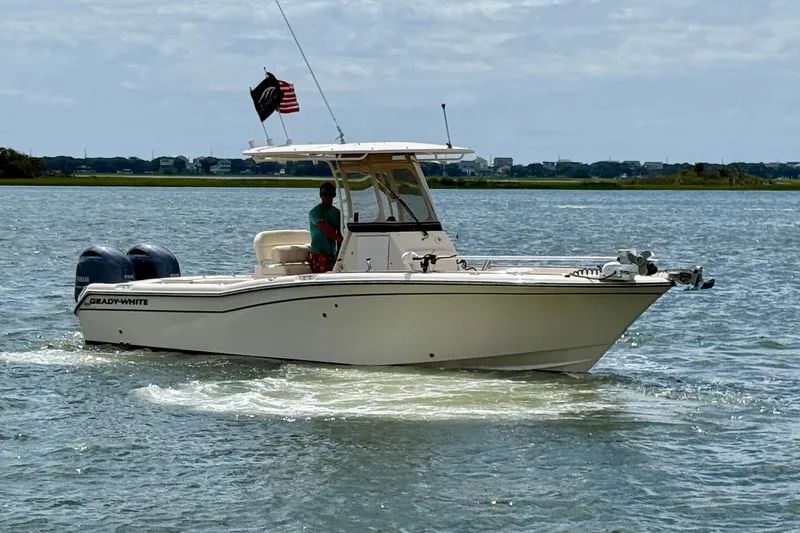 Slide: The Image of 2020 Grady-White Fisherman 257 boat cruising on a calm waterway. - 3