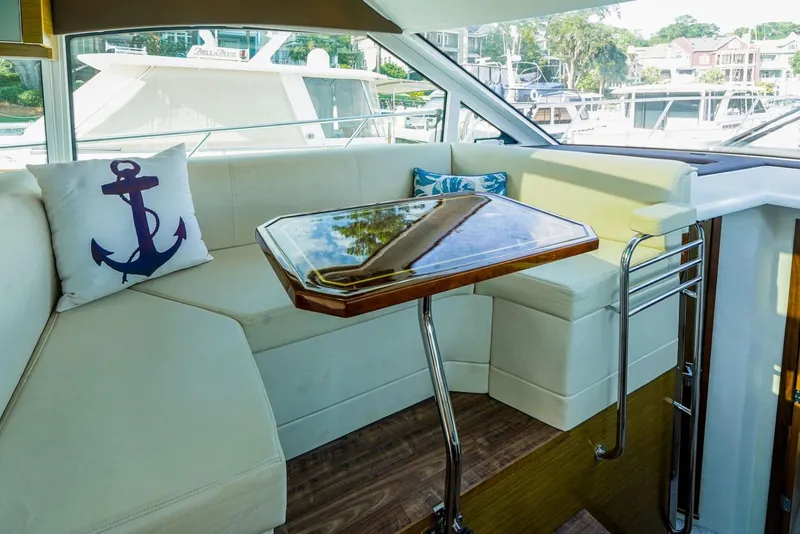 Slide: The Image of Luxurious interior of 2016 Cruisers Yachts 45 Cantius with elegant seating and nautical decor. - 10