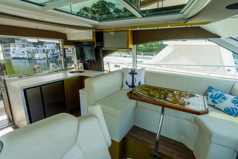 Slide: The Image of Luxurious interior of 2016 Cruisers Yachts 45 Cantius with elegant seating and scenic views. - 11