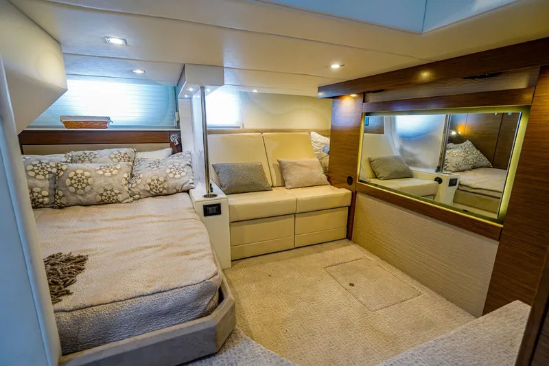 Slide: The Image of Luxurious interior of 2016 Cruisers Yachts 45 Cantius with cozy bed and seating area. - 16
