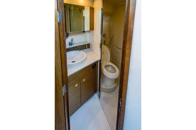 Slide: The Image of Bathroom interior of 2016 Cruisers Yachts 45 Cantius, featuring sink and toilet. - 20
