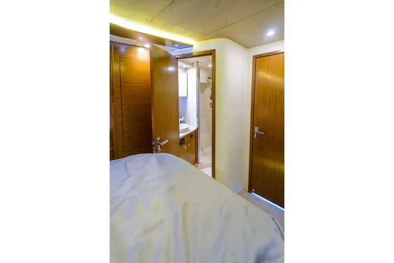 Slide: The Image of Interior of 2016 Cruisers Yachts 45 Cantius, featuring a cozy cabin and bathroom. - 23