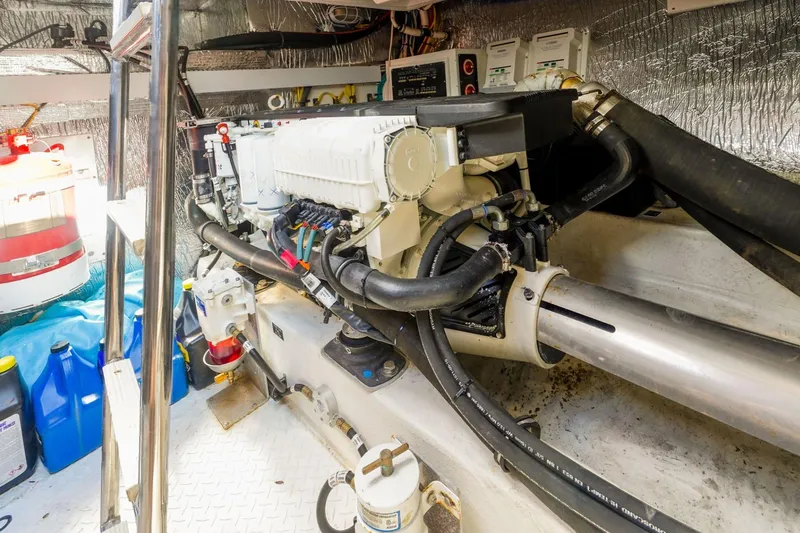 Slide: The Image of Engine room of 2016 Cruisers Yachts 45 Cantius with visible machinery and equipment. - 26