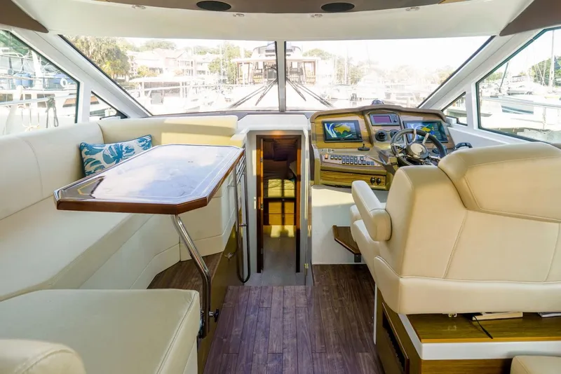 Slide: The Image of Luxurious interior of 2016 Cruisers Yachts 45 Cantius with helm and seating area. - 9