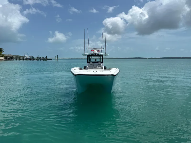 Slide: The Image of Freeman 38 boat on clear turquoise water under a partly cloudy sky, 2025 model. - 10