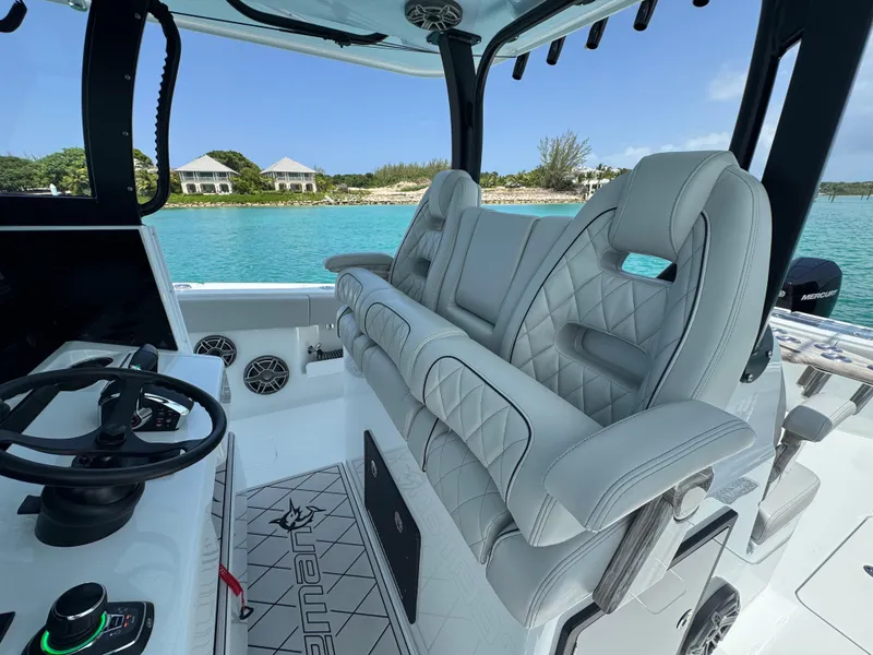 Slide: The Image of Luxurious interior of 2025 Freeman 38 boat with plush seating and scenic ocean view. - 14