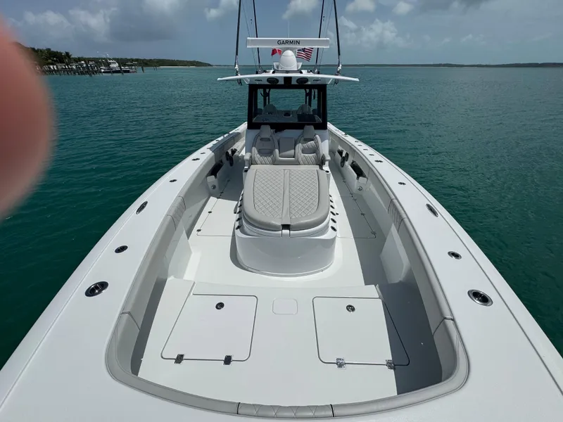 Slide: The Image of 2025 Freeman 38 boat on calm water, featuring spacious deck and modern design. - 17