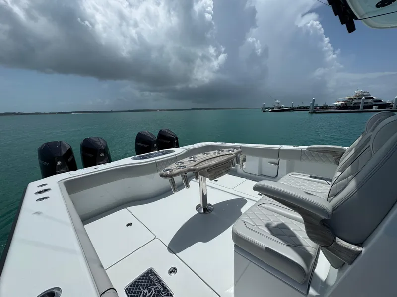 Slide: The Image of Luxury Freeman 38 boat interior with seating, ocean view, and Mercury engines, 2025 model. - 22