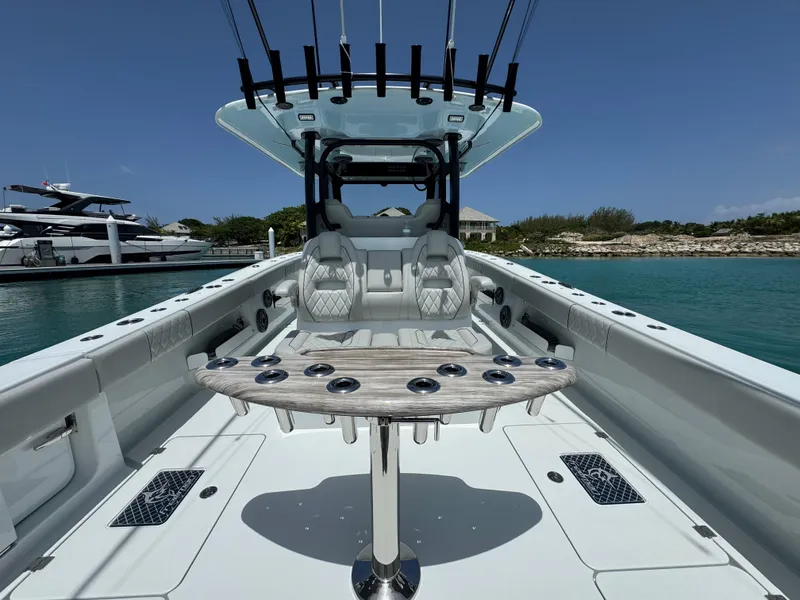 Slide: The Image of Freeman 38 boat interior, 2025 model, featuring luxury seating and fishing rod holders. - 26
