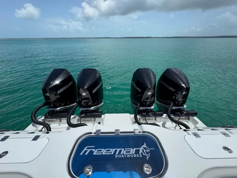 Slide: The Image of Freeman 38 boat with four Mercury engines on a calm sea, 2025 model. - 31