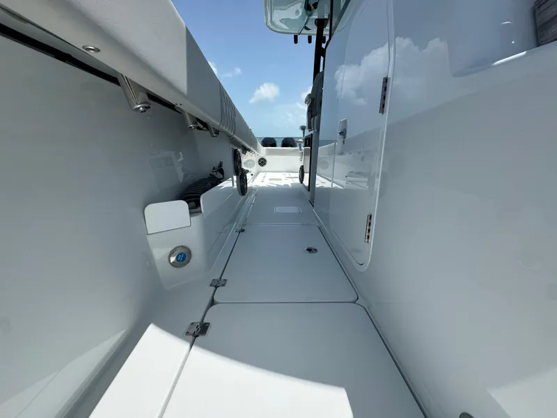 Slide: The Image of 2025 Freeman 38 boat interior, sleek white design with modern features and clear blue sky. - 36