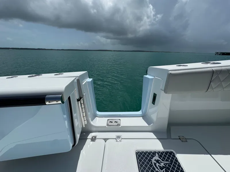 Slide: The Image of Freeman 38 boat, 2025 model, with open deck view of calm sea and cloudy sky. - 39