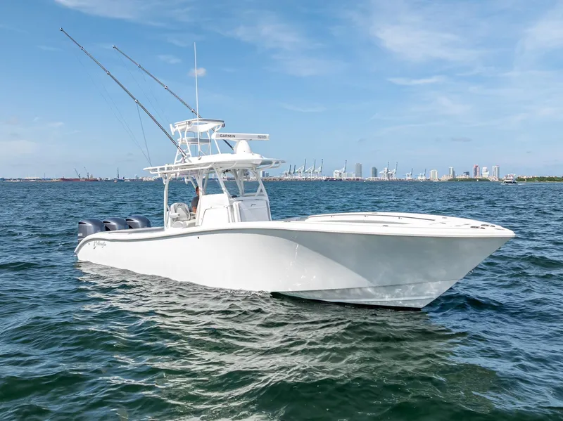 The Image of 2021 Yellowfin 34 boat on open water with city skyline in background. - 0