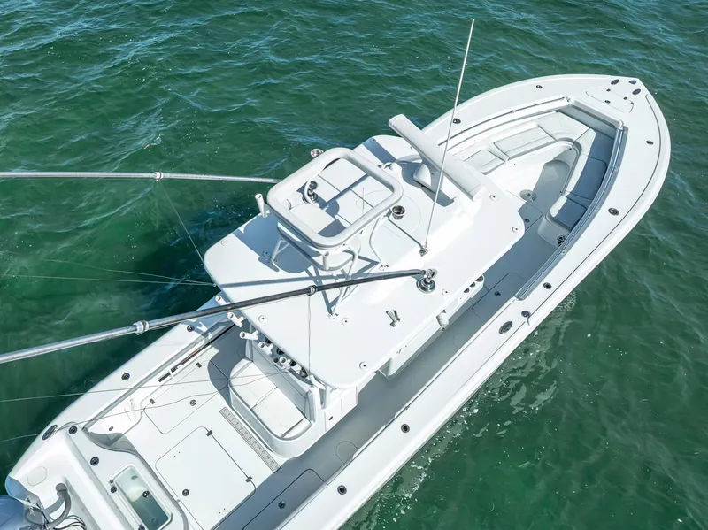 Slide: The Image of 2021 Yellowfin 34 boat on clear green water, aerial view. - 18