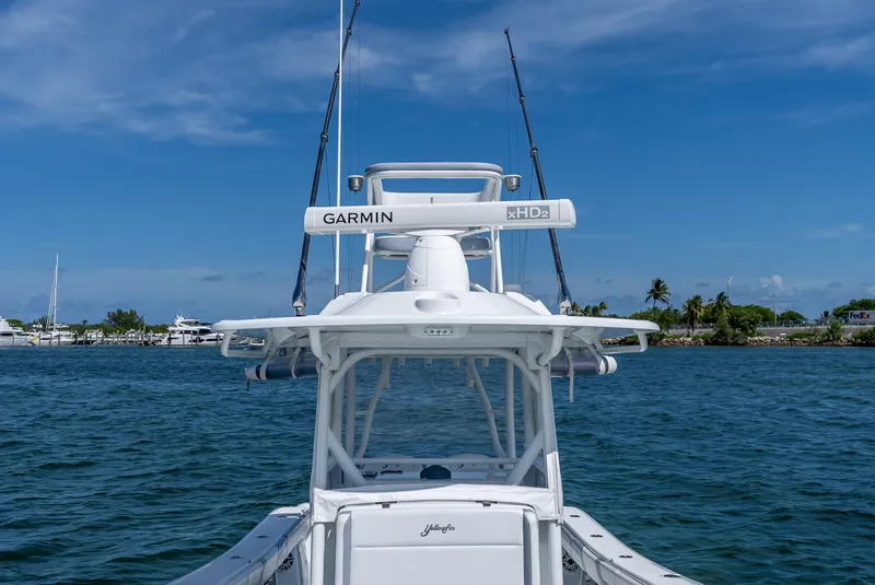 Slide: The Image of 2021 Yellowfin 34 boat with Garmin equipment on a sunny day at the marina. - 40