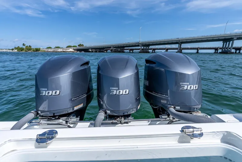 Slide: The Image of Triple Yamaha 300 outboard engines on a 2021 Yellowfin 34 boat, near a bridge. - 46