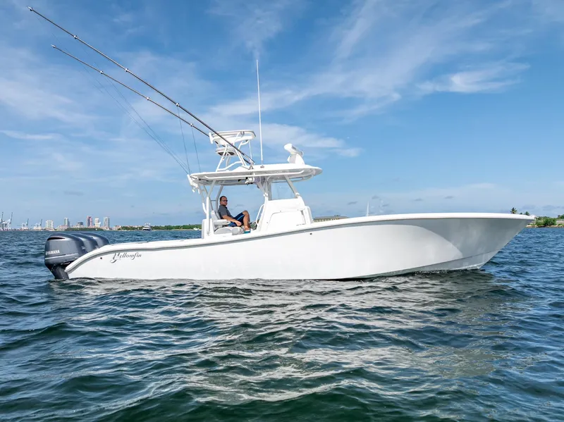 Slide: The Image of 2021 Yellowfin 34 boat on water with clear blue sky background. - 5