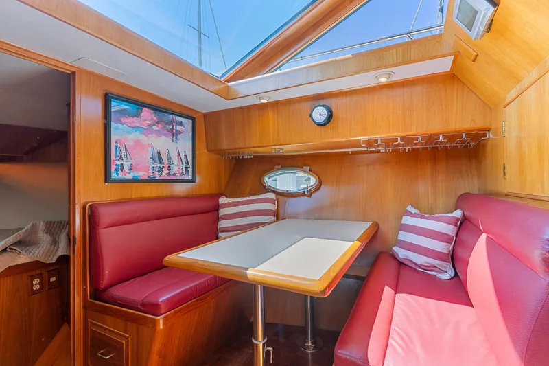 Slide: The Image of Luxurious 1993 Ocean Alexander 440 yacht interior with red seating and skylight. - 21