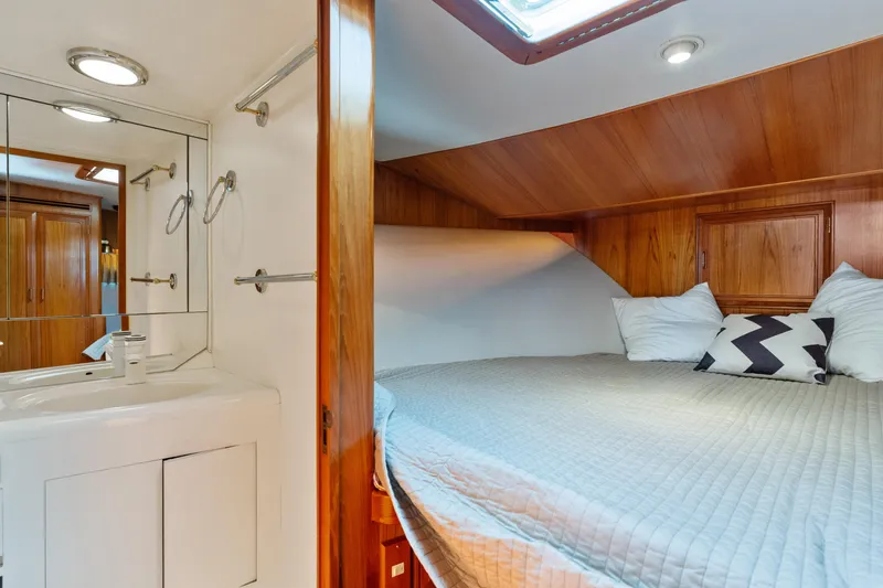 Slide: The Image of Cozy cabin interior of 1993 Ocean Alexander 440 yacht with bed and vanity. - 25