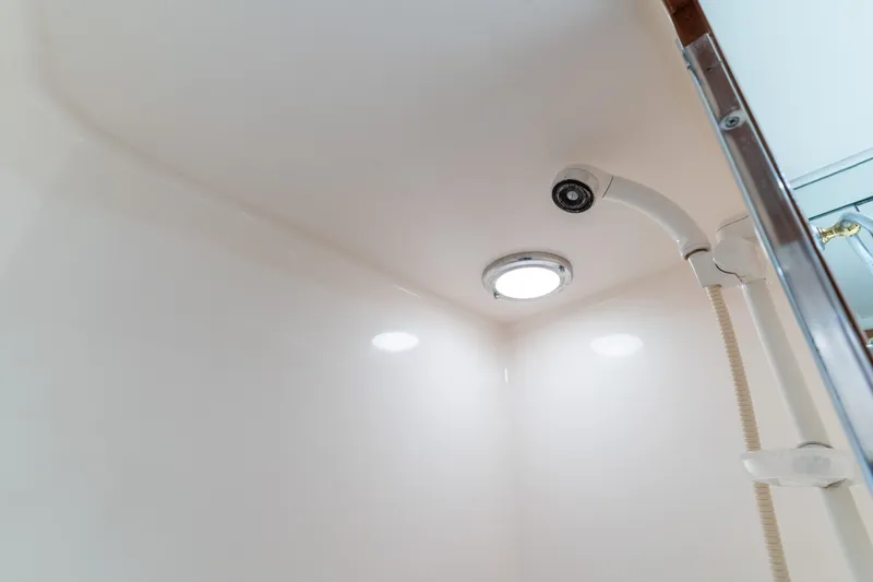 Slide: The Image of Shower area in 1993 Ocean Alexander 440 yacht, featuring modern fixtures and lighting. - 32