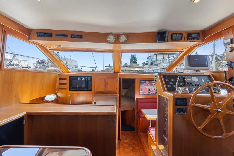 Slide: The Image of Interior of 1993 Ocean Alexander 440 yacht with wooden helm and navigation equipment. - 34