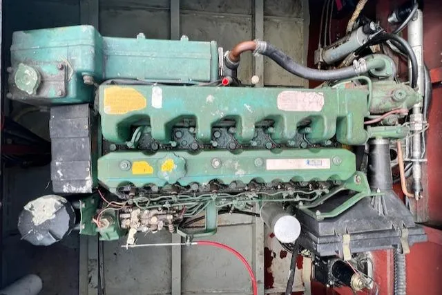 Slide: The Image of 1984 Skipperliner 54 engine, green, detailed view, mechanical components visible. - 12