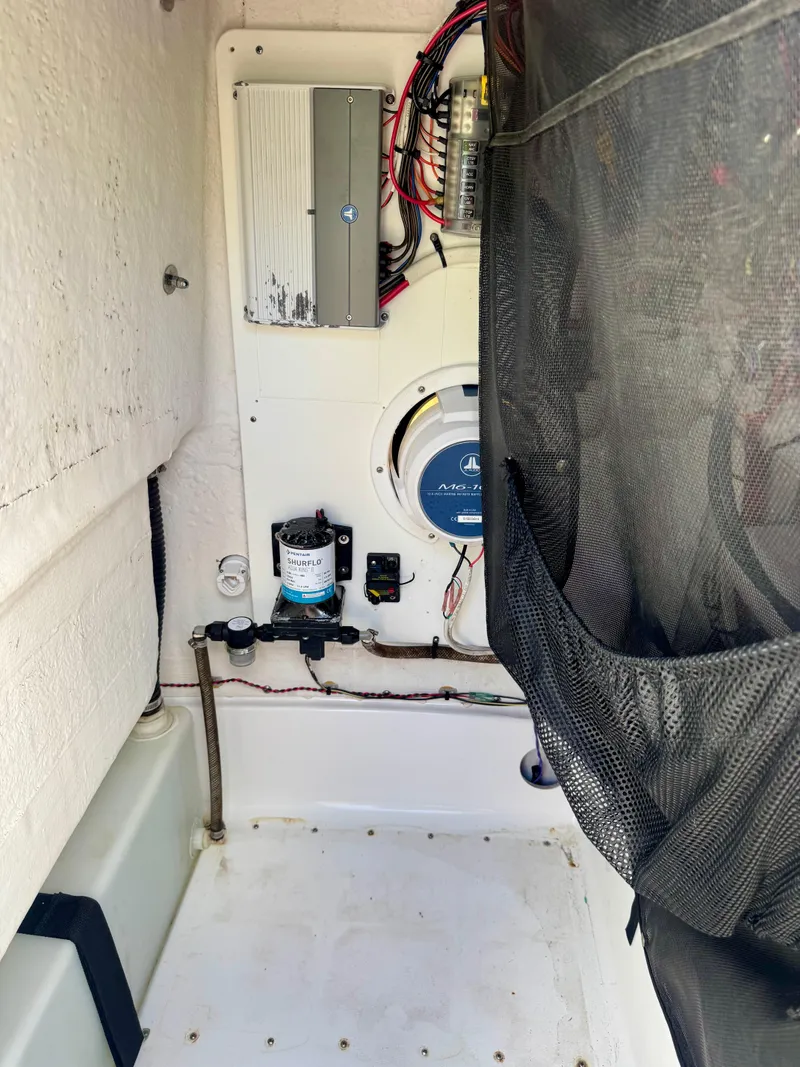 Slide: The Image of 2020 Sportsman Open 232 Center Console interior wiring and components. - 11