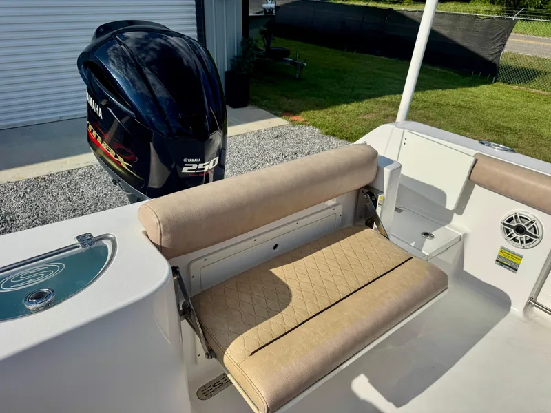 Slide: The Image of 2020 Sportsman Open 232 Center Console boat with Yamaha 250 engine and cushioned seating. - 13