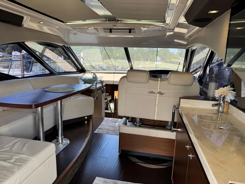 Slide: The Image of Luxurious interior of 2014 Sea Ray 510 Sundancer yacht with elegant seating and modern amenities. - 10
