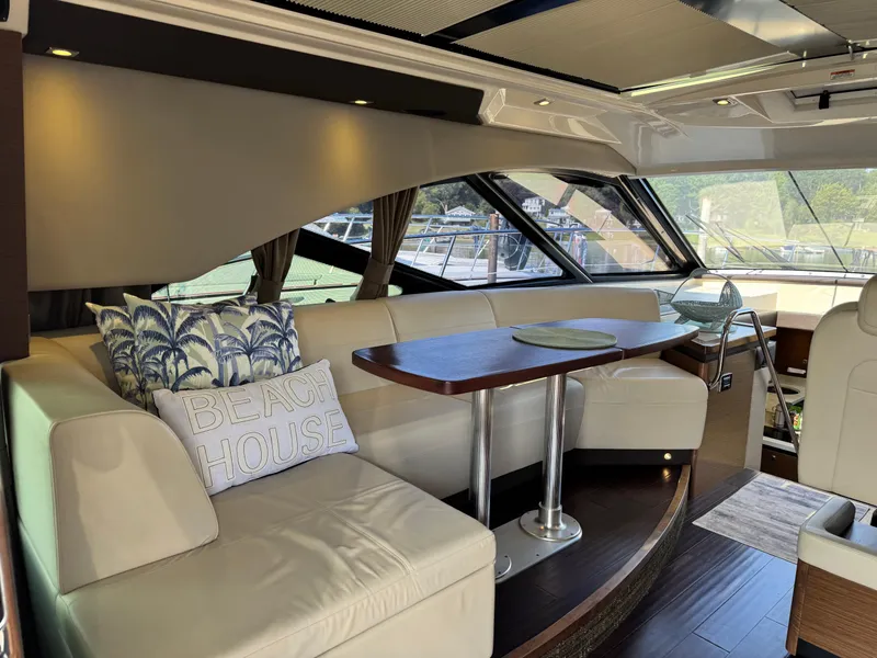 Slide: The Image of Luxurious interior of 2014 Sea Ray 510 Sundancer yacht with elegant seating and decor. - 11