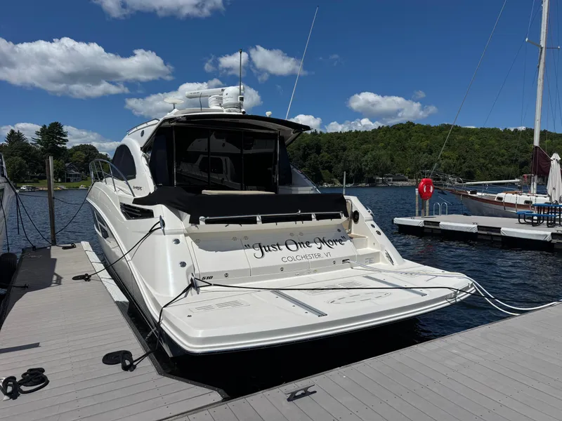 Slide: The Image of 2014 Sea Ray 510 Sundancer yacht docked on a sunny day. - 2