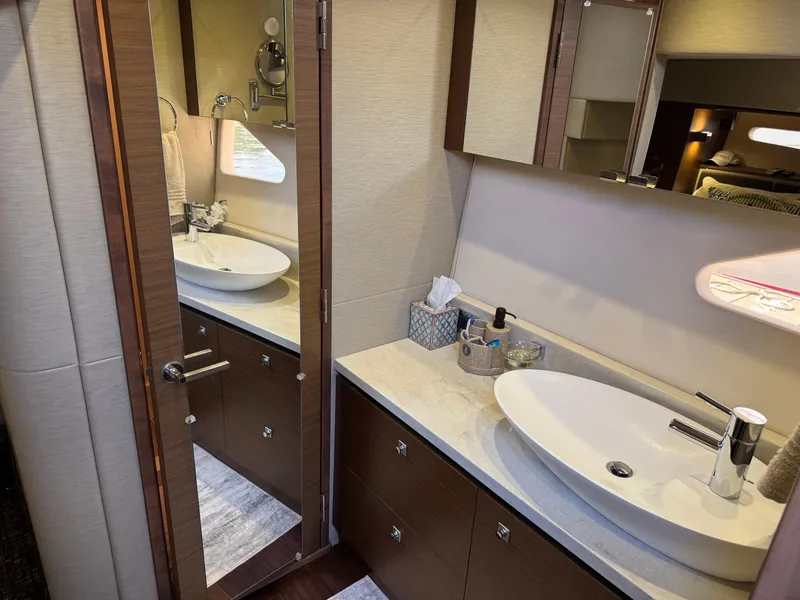 Slide: The Image of Luxurious bathroom interior of 2014 Sea Ray 510 Sundancer yacht with modern sink and mirror. - 28