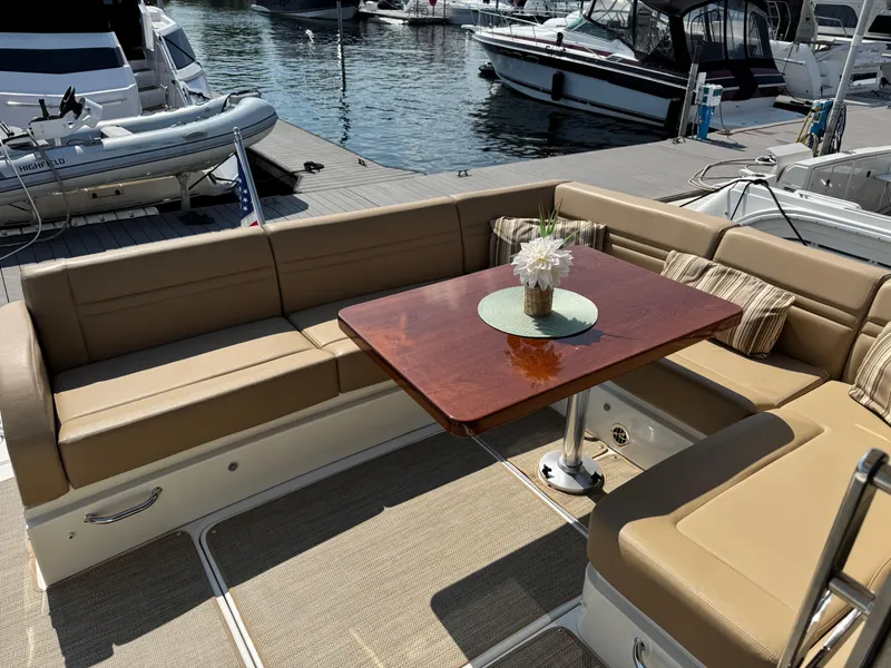 Slide: The Image of Luxurious seating area on 2014 Sea Ray 510 Sundancer yacht with elegant table and decor. - 37