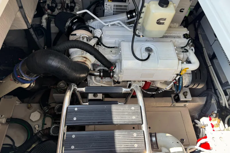 Slide: The Image of Engine compartment of a 2014 Sea Ray 510 Sundancer yacht, featuring Cummins engine components. - 40