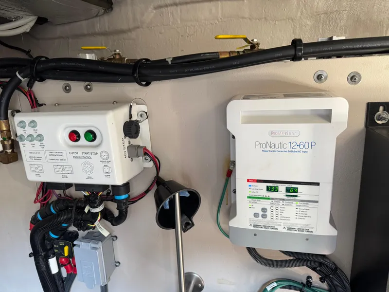 Slide: The Image of Engine control and ProNautic charger in 2014 Sea Ray 510 Sundancer boat. - 42