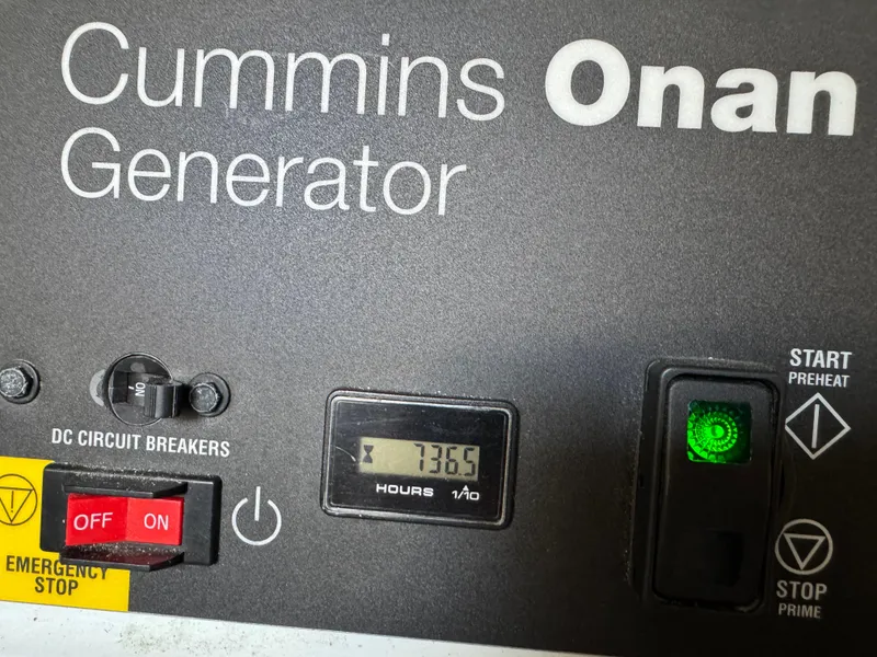 Slide: The Image of Cummins Onan generator control panel with 736.5 hours, Sea Ray 510 Sundancer 2014. - 49