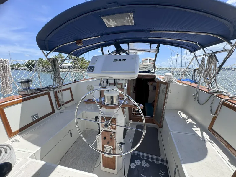 Slide: The Image of Cockpit of a 1979 CSY 44 sailboat with steering wheel and navigation equipment. - 8
