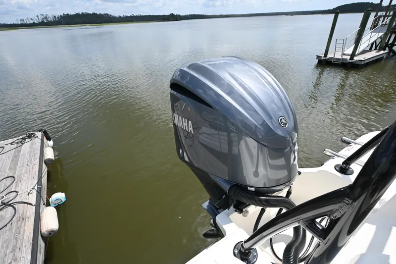 Slide: The Image of 2024 Key West 239 FS boat with Yamaha outboard motor on a calm lake. - 10