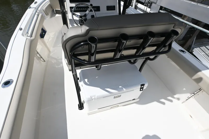 Slide: The Image of 2024 Key West 239 FS boat interior with seating and storage. - 11