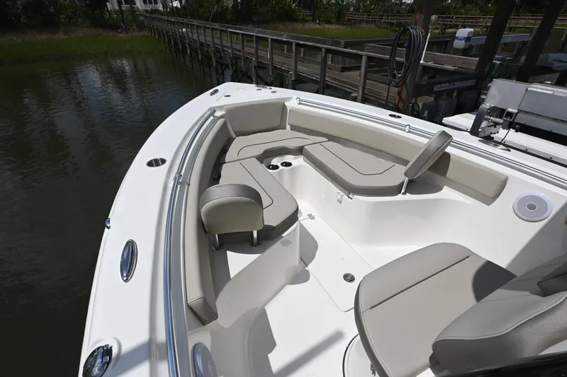 Slide: The Image of 2024 Key West 239 FS boat interior with cushioned seating and sleek design. - 6