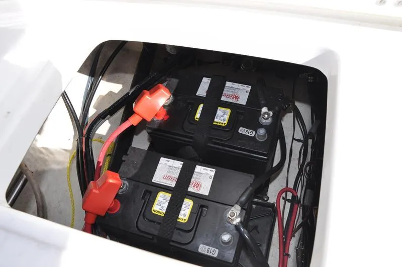Slide: The Image of Batteries installed in a 2020 Sea Hunt Ultra 225 boat compartment. - 10