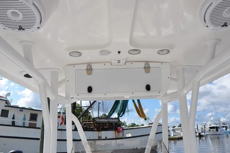 Slide: The Image of 2020 Sea Hunt Ultra 225 boat interior with speakers and storage compartment. - 16