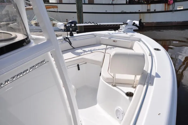 Slide: The Image of 2020 Sea Hunt Ultra 225 boat interior with seating and fishing equipment. - 20