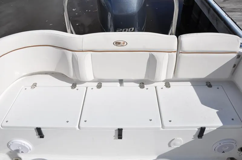Slide: The Image of 2020 Sea Hunt Ultra 225 boat interior with seating and storage compartments. - 6