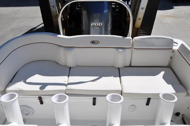 Slide: The Image of 2020 Sea Hunt Ultra 225 boat with cushioned seating and Yamaha 200 engine. - 7