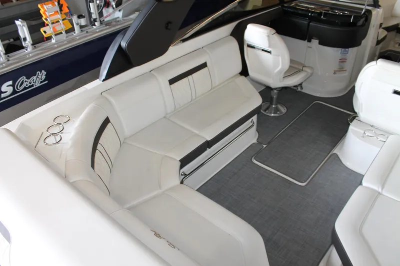 Slide: The Image of 2018 Sea Ray 280 SLX boat interior with white seating and modern design. - 11