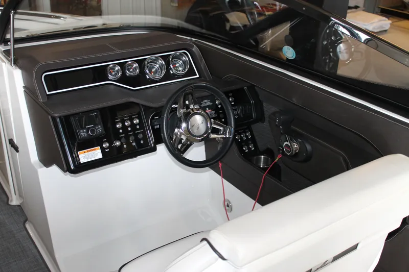 Slide: The Image of 2018 Sea Ray 280 SLX boat dashboard with steering wheel and control panel. - 14