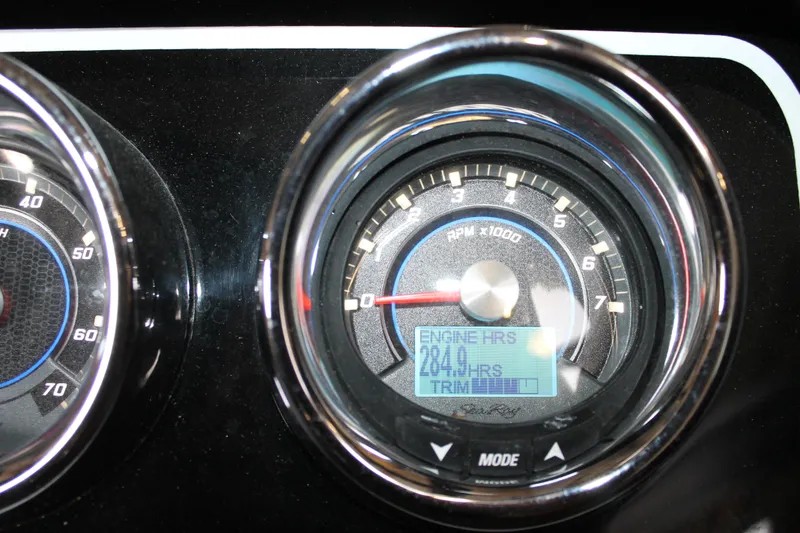 Slide: The Image of Close-up of 2018 Sea Ray 280 SLX dashboard showing RPM gauge and engine hours. - 15