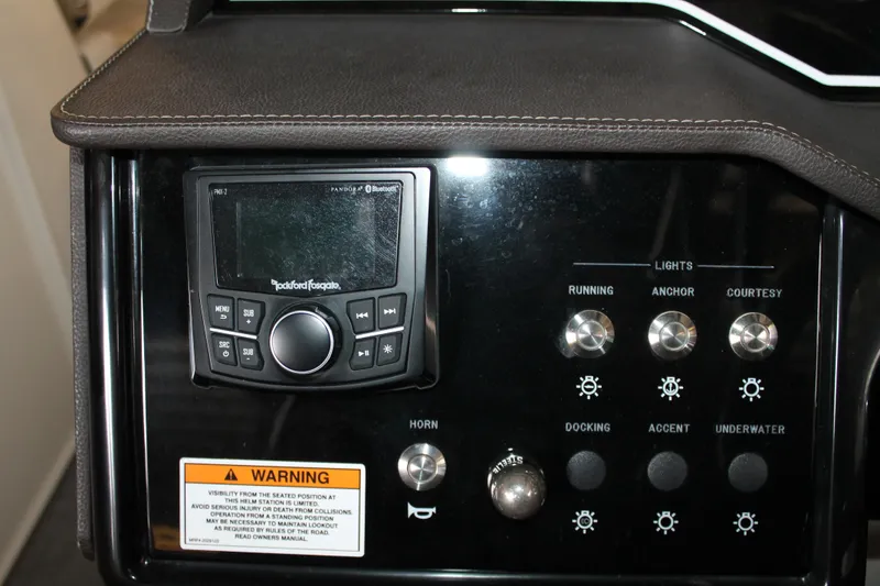 Slide: The Image of Control panel of 2018 Sea Ray 280 SLX boat with audio system and light switches. - 16